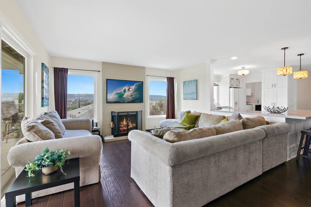 Comfortable sofas and a cozy fireplace in the beautiful living room.