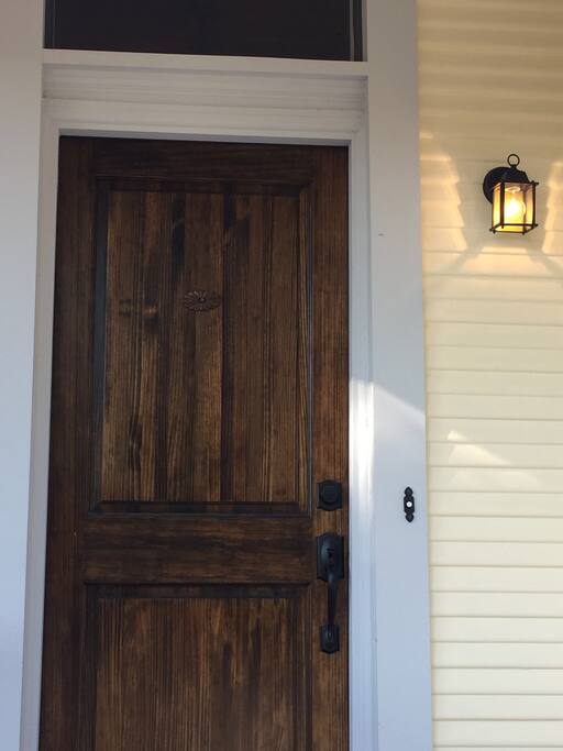 The front porch is safely lit and welcoming.