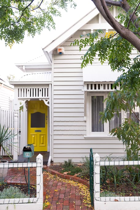 Edwardian weatherboard house with distinct features.