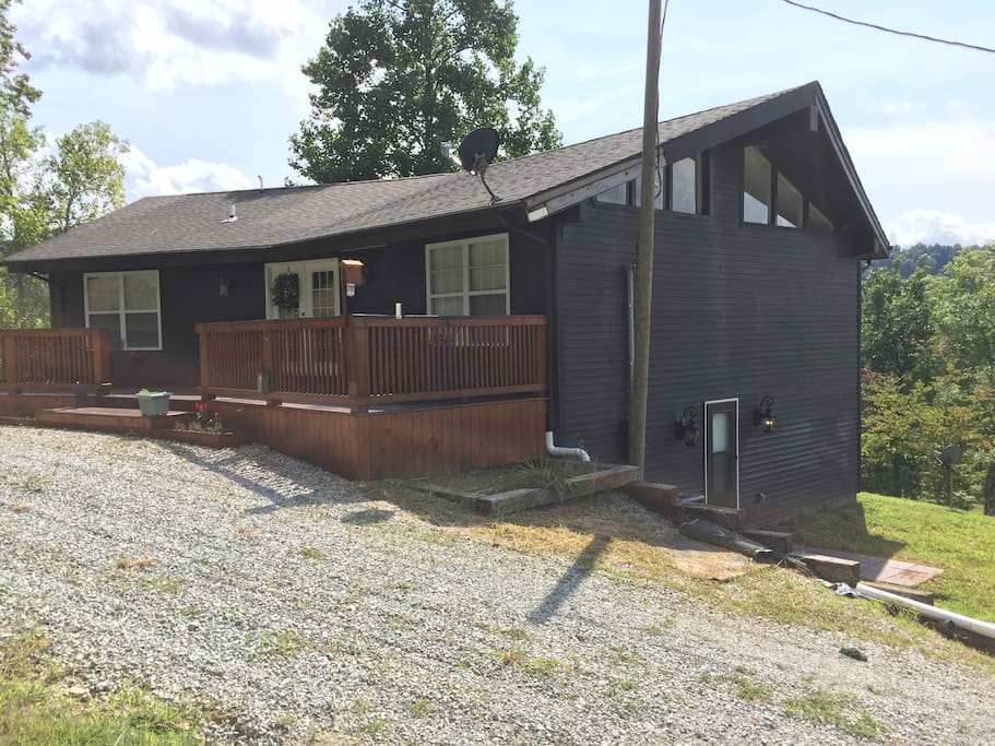 Back of house with large deck