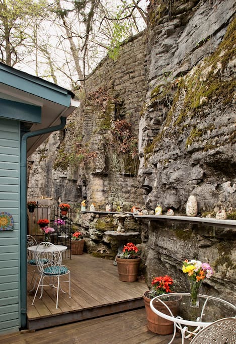 Deck behind Cliff Cottage (Tennyson Suite) with age-old 3-story rock bluff, with Tennyson's 2-person outdoor shower tucked into bluff (shower available April-Oct.)