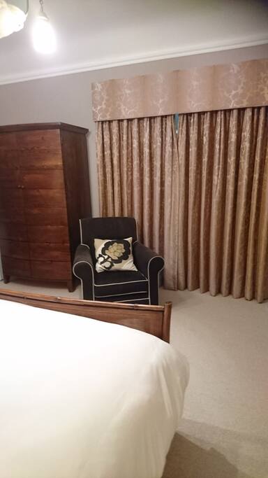 Wooden Shutters and Blackout Curtains for a Perfect Night's Sleep