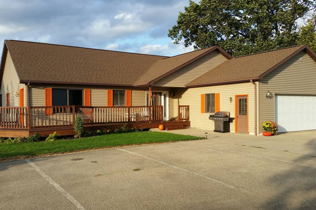 Front of house with parking spots.