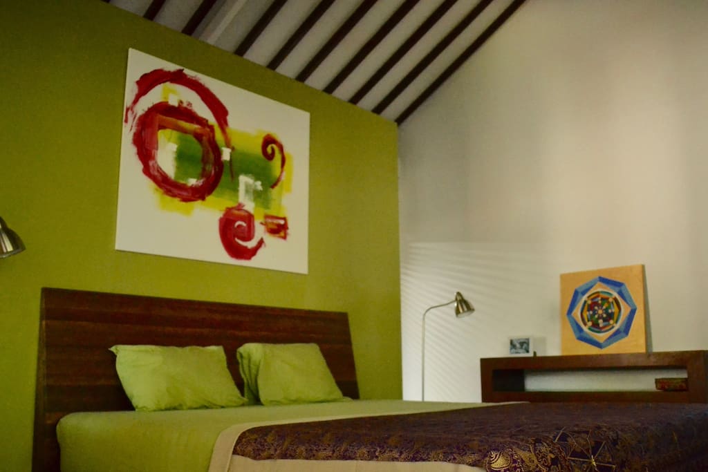 sleepingroom with the king size bed and ac
