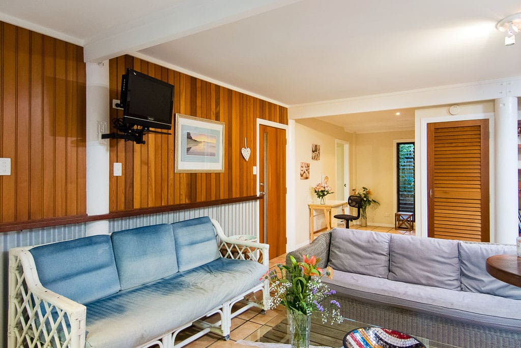 Living room with wall-mounted TV, study