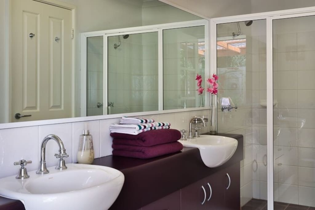 Ensuite bathroom with double showers,and garden views .