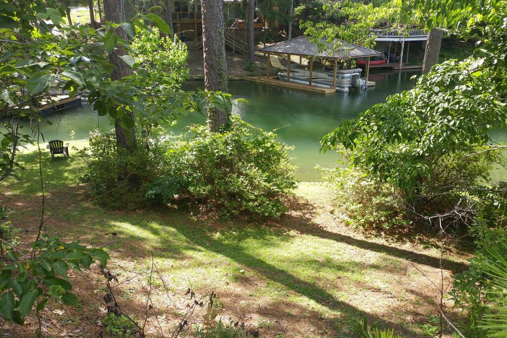 the front yard view. the north portion of property follows a scenic creek. great for fishing, exploring or just sit on top deck and drink coffee or barbeque at sunset and watch fish and turtles swim by.