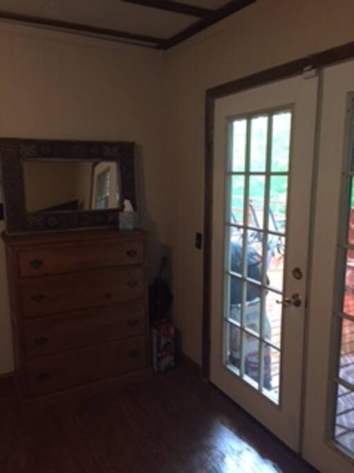 Main queen room with view of deck and Hot tub.