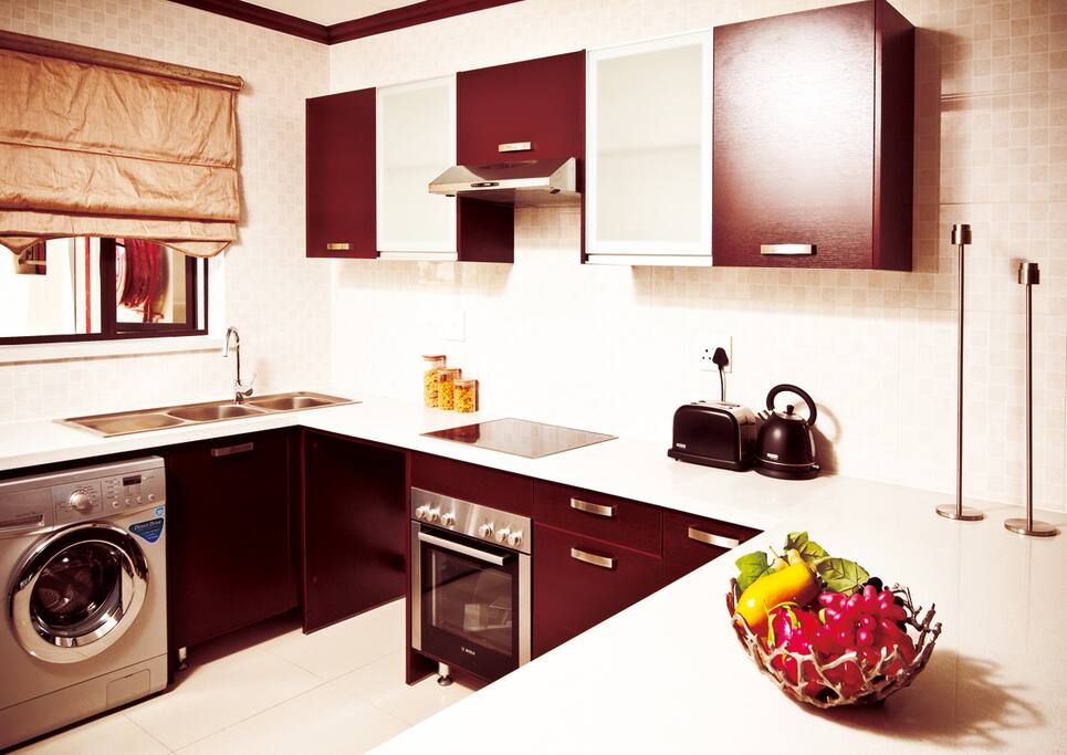 Spacious open plan kitchen with modern appliances.