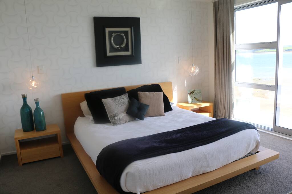 Upstairs master bedroom with Kind bed and ensuite