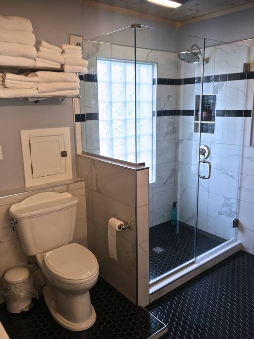 Our elegant newly remodeled full bath. A dream come true! We kept the original laundry shoot.