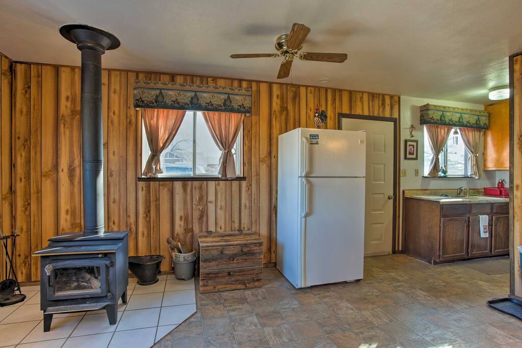 After a day at Grand Mesa or Powderhorn Ski Resort, retreat to the comfort of this Cedaredge vacation rental cabin and warm up in front of the wood-burning stove.