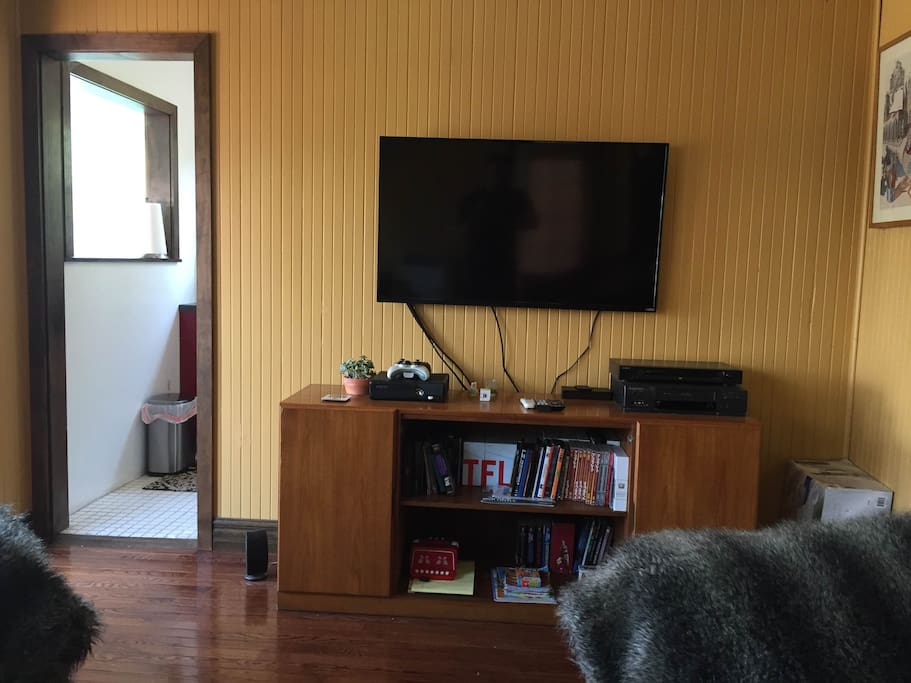 Large HD flat screen TV with Cable, Netflix, Amazon Prime, DVD, and XBox with dozens of games
