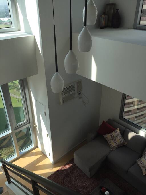 A high ceiling loft unit with a view of the greeneries of Manila Golf Club