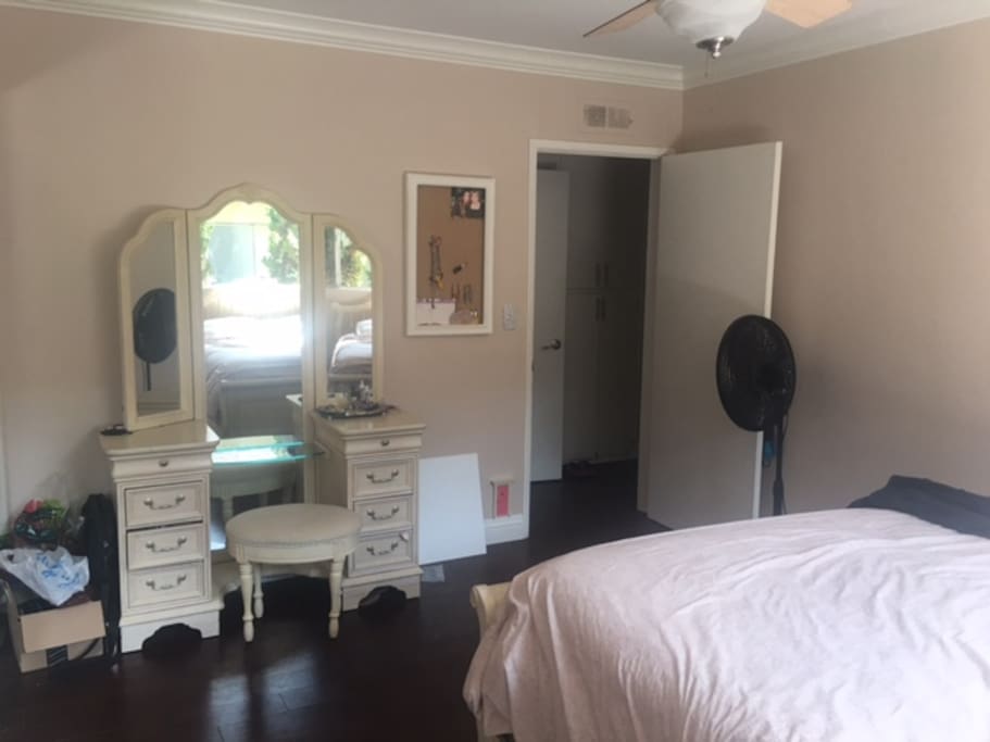 Your vanity table. A fan to use in your room, if youd like. It also has a ceiling fan and windows you can open up for a cool breeze to enter.