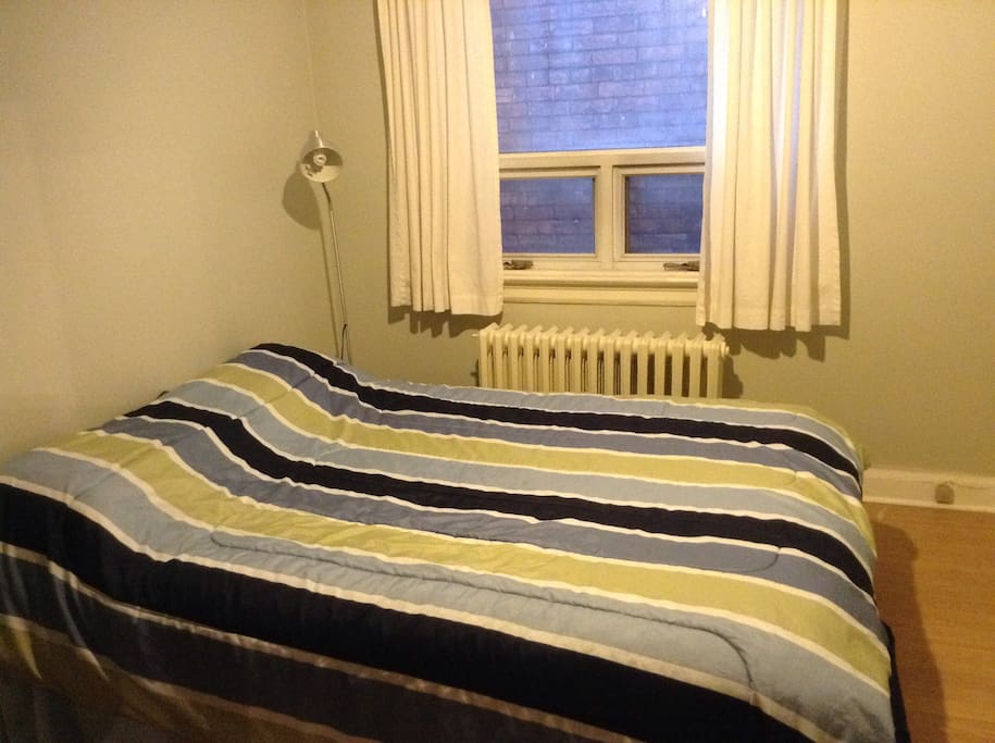 This is the room! That's a queen sized bed. There's also a dresser (not pictured.)