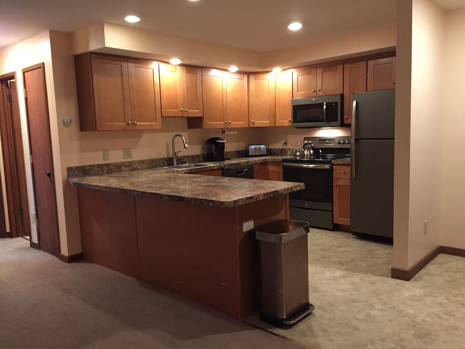 The kitchen has been completely renovated! All new kitchen cabinets, counters, stainless appliances, microwave, dishwasher and flooring! It also comes equipped with many of the items you may need such as Keurig, tea kettle, toaster, cook pots, cups, plates, and utensils!!