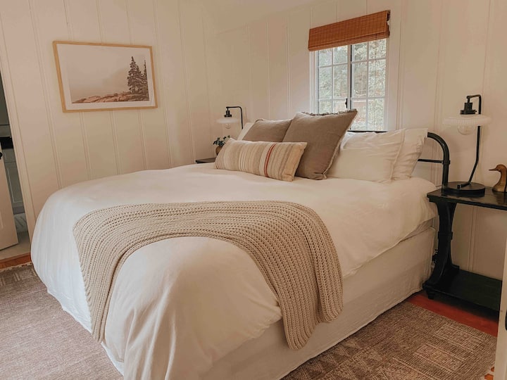 Downstairs master suite with king bed and black out shades. 