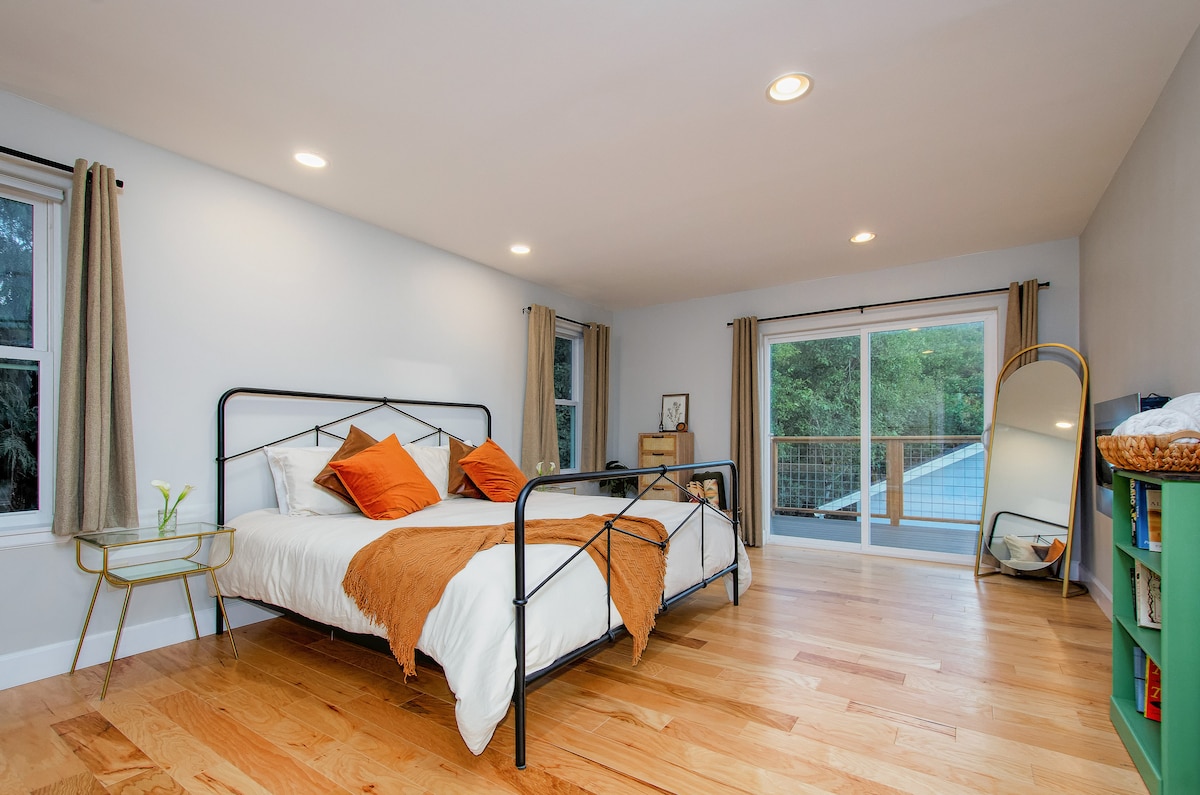 Primary Bedroom Upstairs with King Sized Bed and Yoga Deck