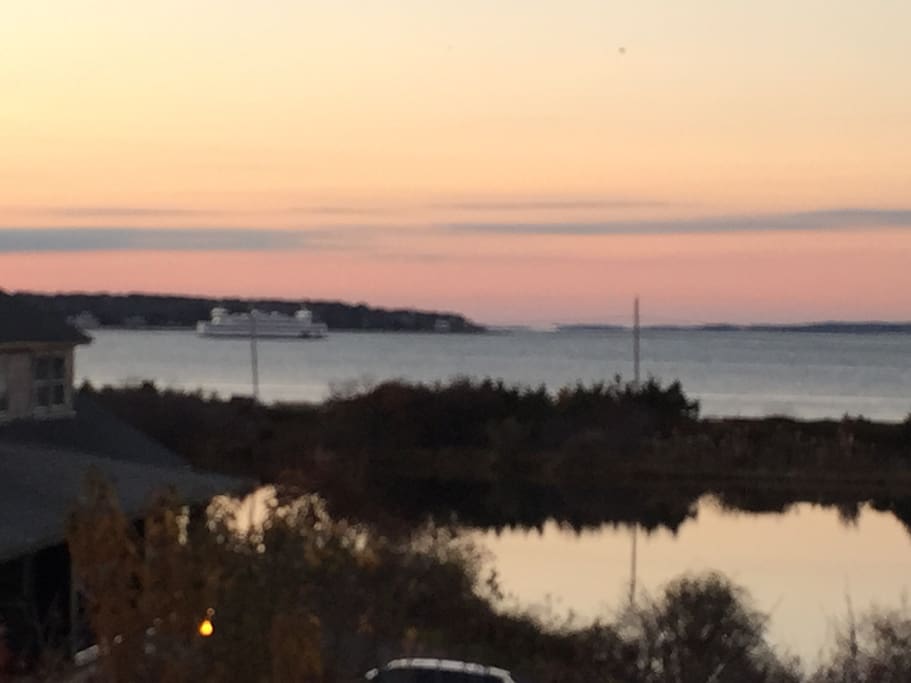 Living room / deck view - ferry at sunset