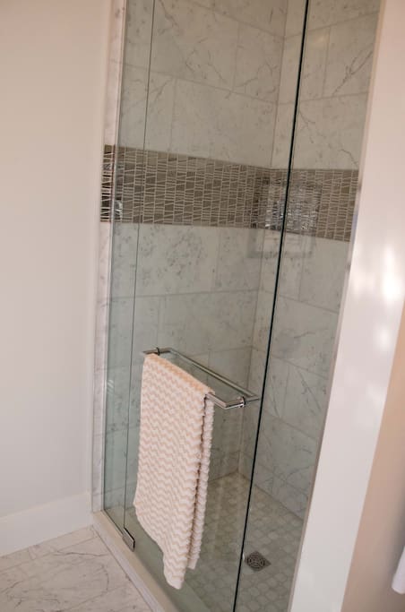 Private marble ensuite shower.