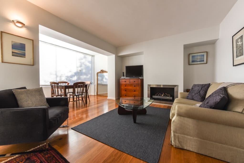 Lovely, light, bright open plan living area with electric fireplace.
