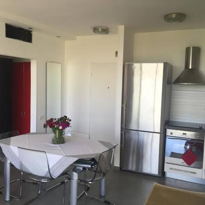 Dinning table
Stainless steel refrigerator,stoves and an oven.
