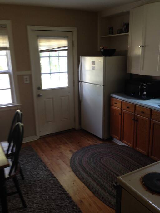 Kitchen. Sink, Stove, Fridge, table.