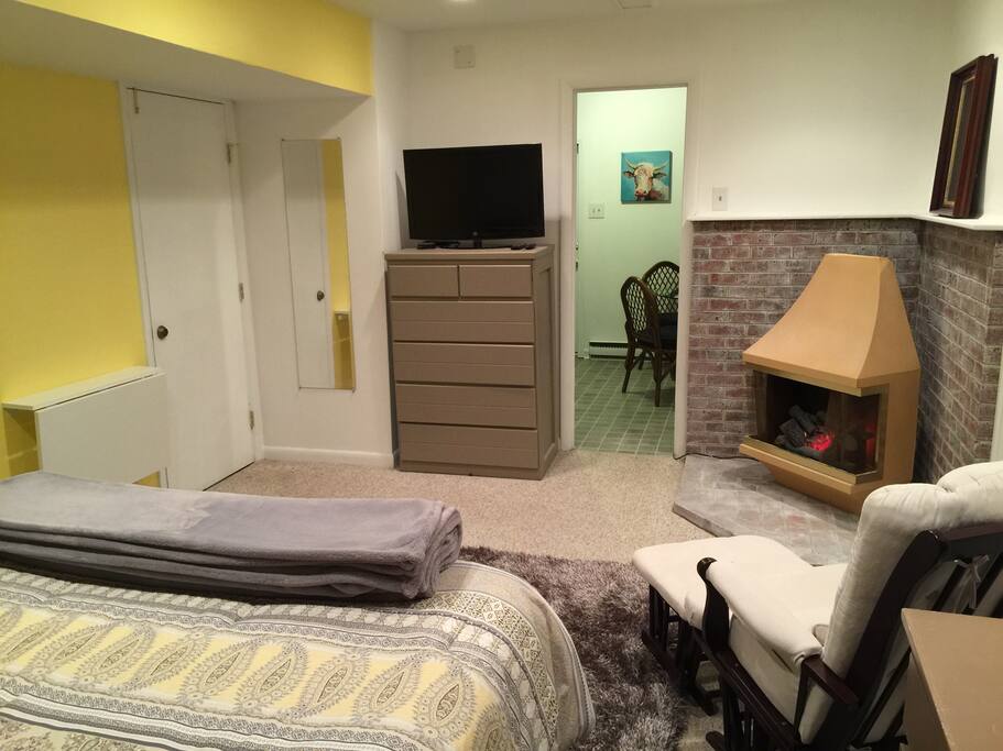 Television with Roku, a fold out desk for work, electric fireplace for added comfort.