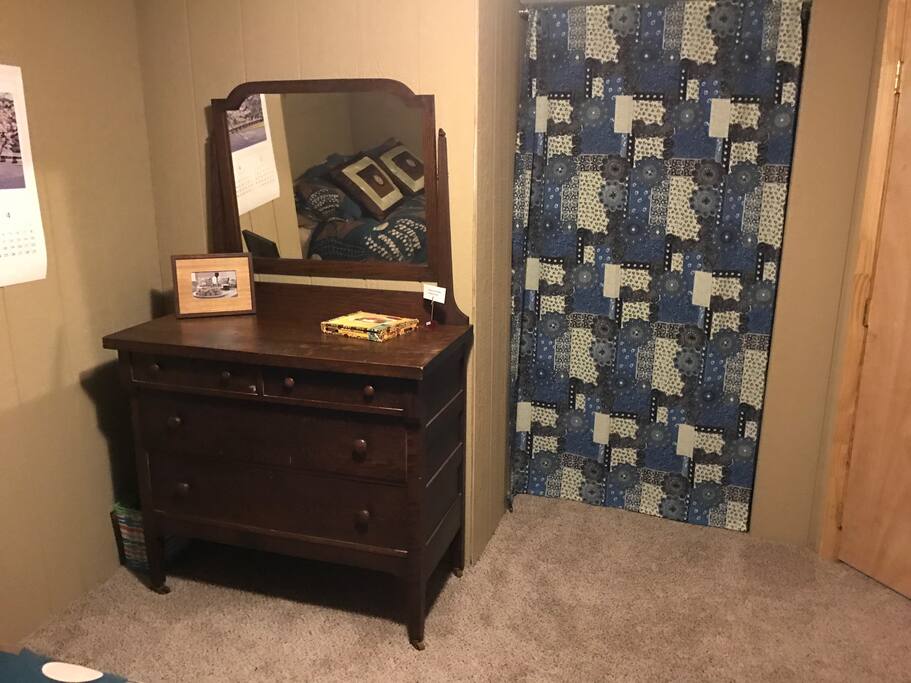 Dresser is ready for use; walk-in closet beside it