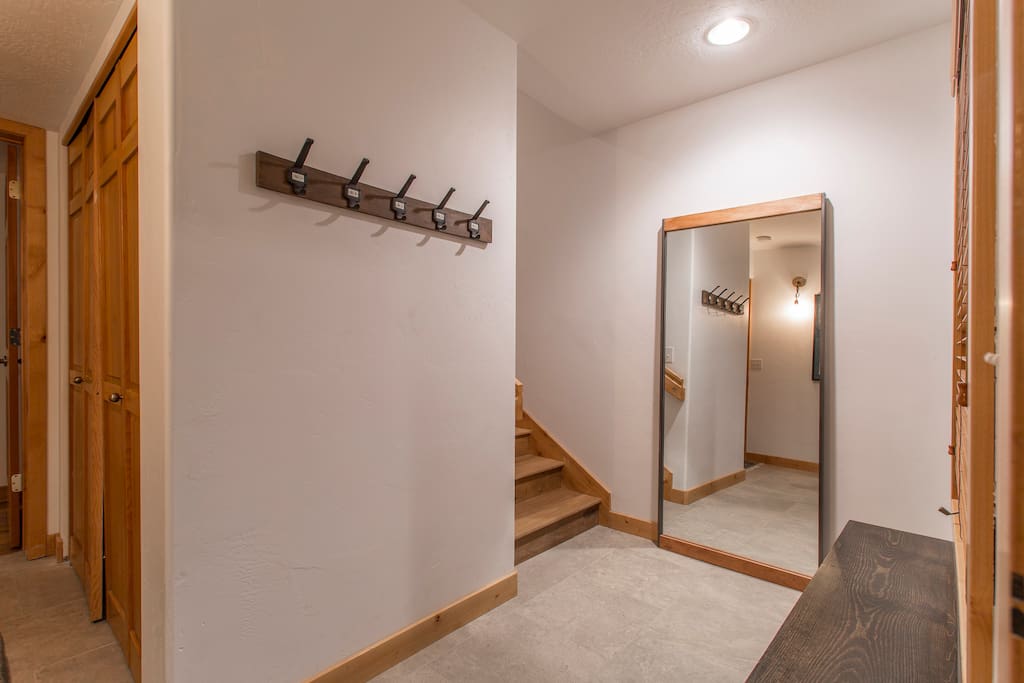 This is the entry way on the first floor where people hang their coats and take off their shoes and boots