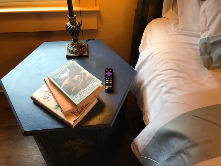 Master Bedroom with queen sized bed, 32" flat screen, Smart TV with cable, sitting area and closet