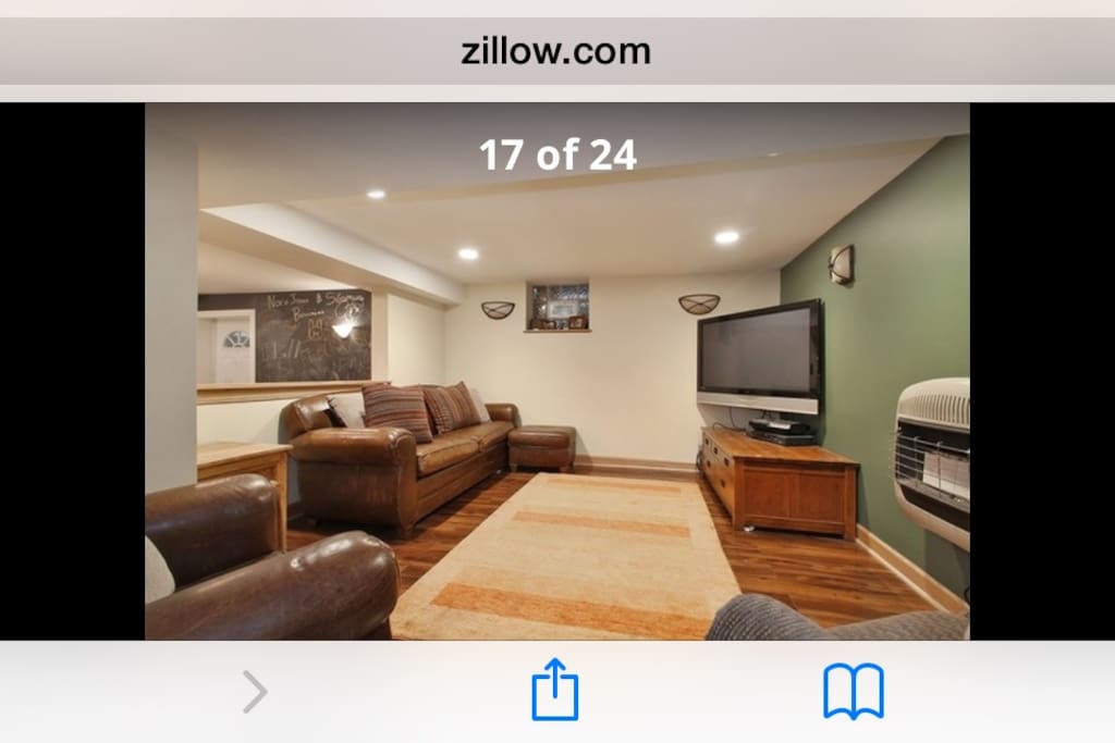 Comfortable living area with large TV and Cable