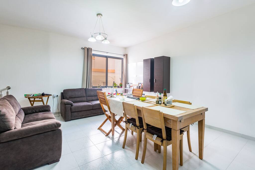 Spacious bright living room to share with the host and other guests.