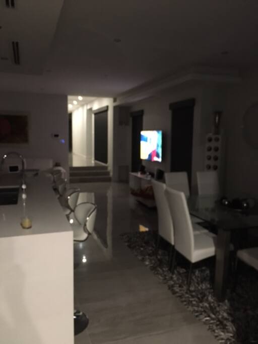 Large Curved TV in Living Room and Bedroom