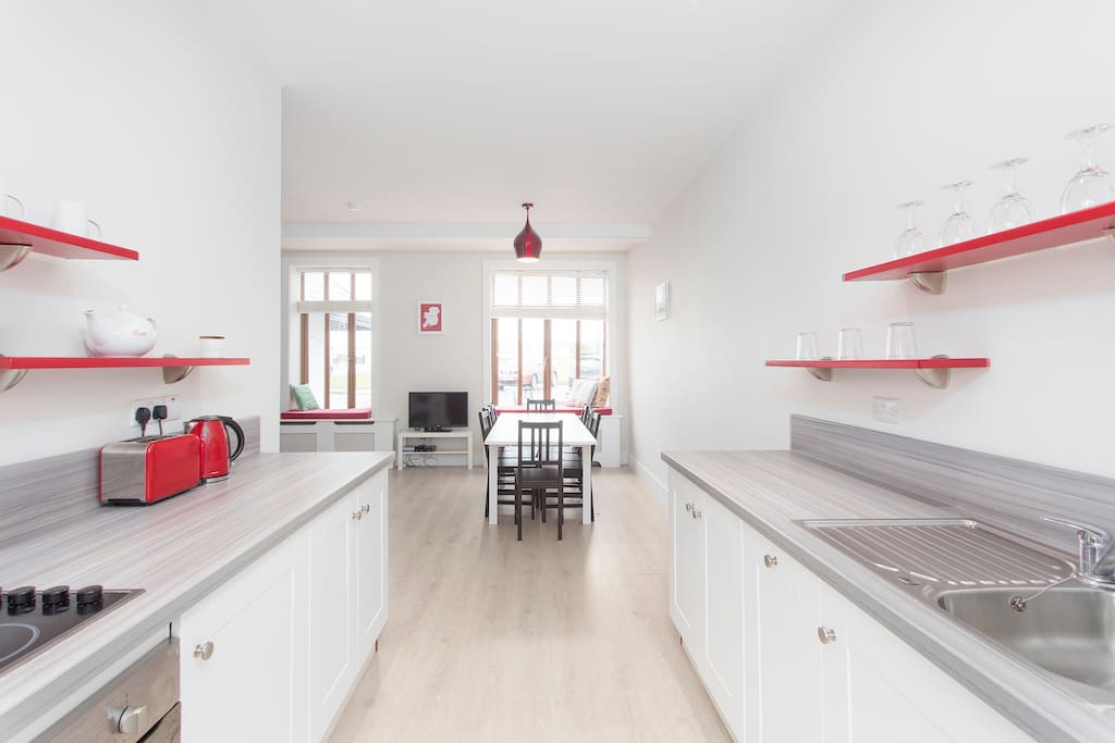 Open clean kitchen facing the dining area