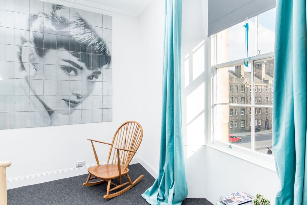 The double bedroom is large and has this fine spot for reading or rocking under Audrey Hepburn's gaze