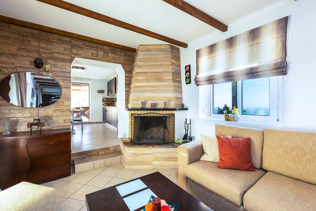 Living room of our apartment with fireplace, HDTV, sofa, etc.