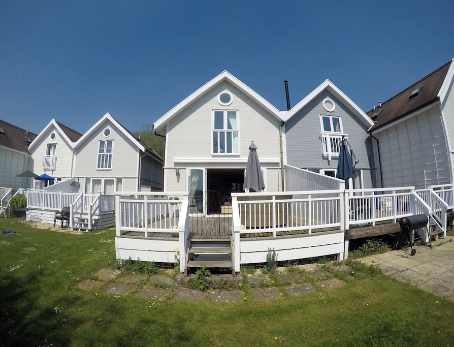 Rear of the lodge; decking area & master bedroom up top.