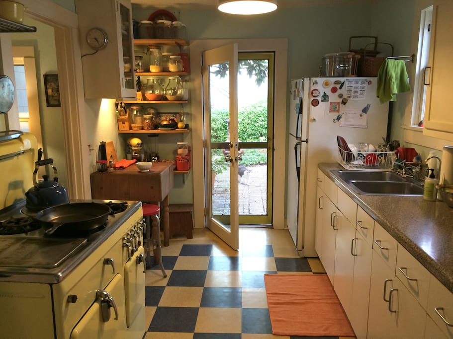 Kitchen opens to garden and patio.