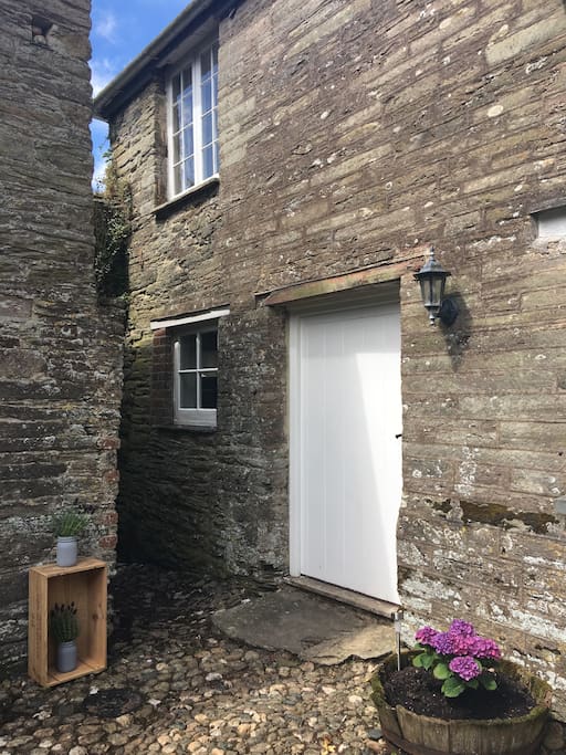 Front door with bedroom window top left