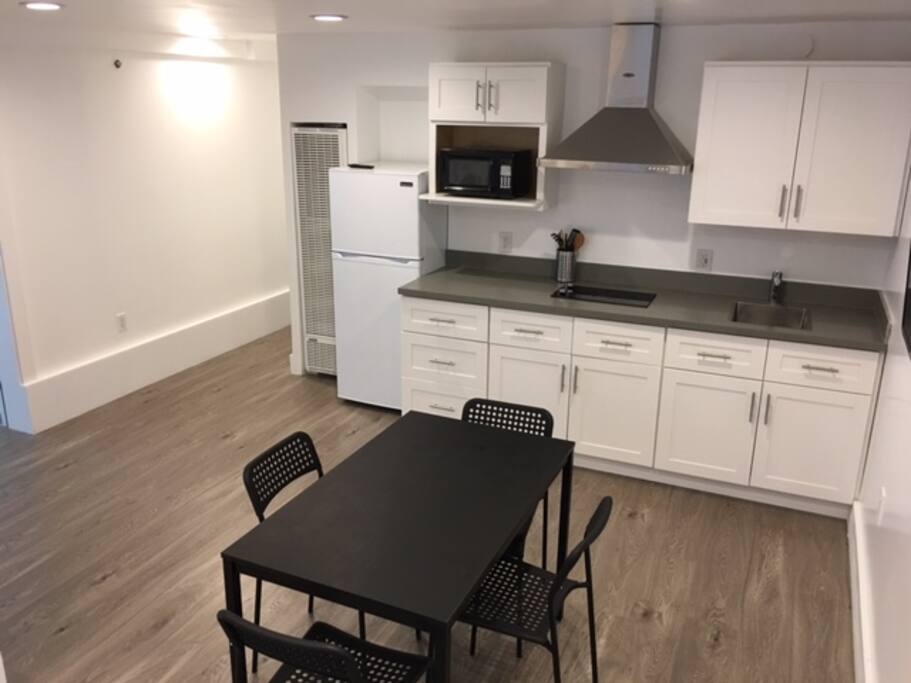 Kitchen includes basic utensils, cookware and tableware.