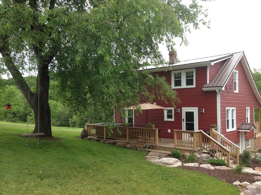 Old fashioned tree swing. Rear exterior patio. Enjoy 10 acres of trails and scenery.