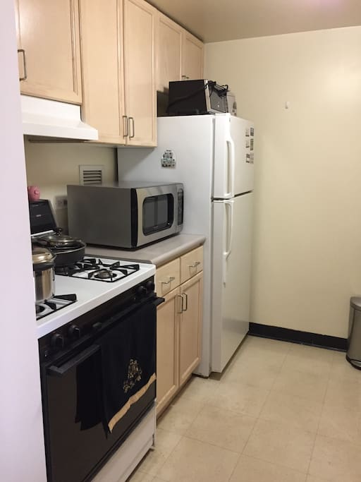 Full size separate kitchen with microwave and dishwasher