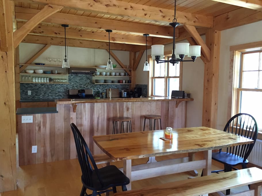 LED lighting in gourmet kitchen. Live edge dining table for eight