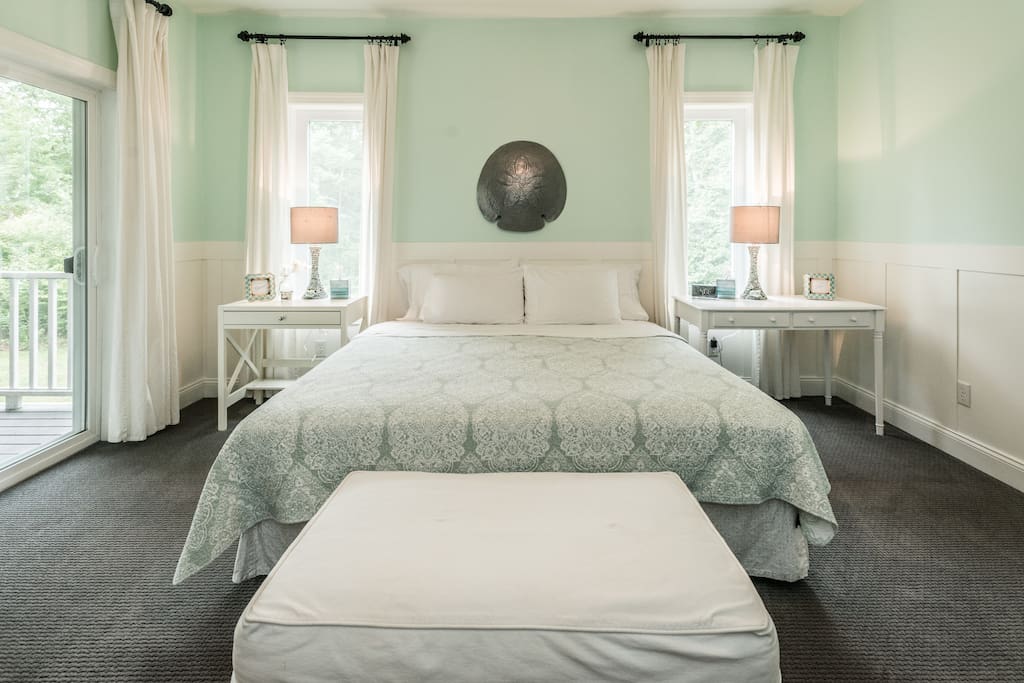 Tranquil master bedroom on main floor with a sliding door to the porch. King size bed and all cotton linens. Walk-in closet for guest use.
