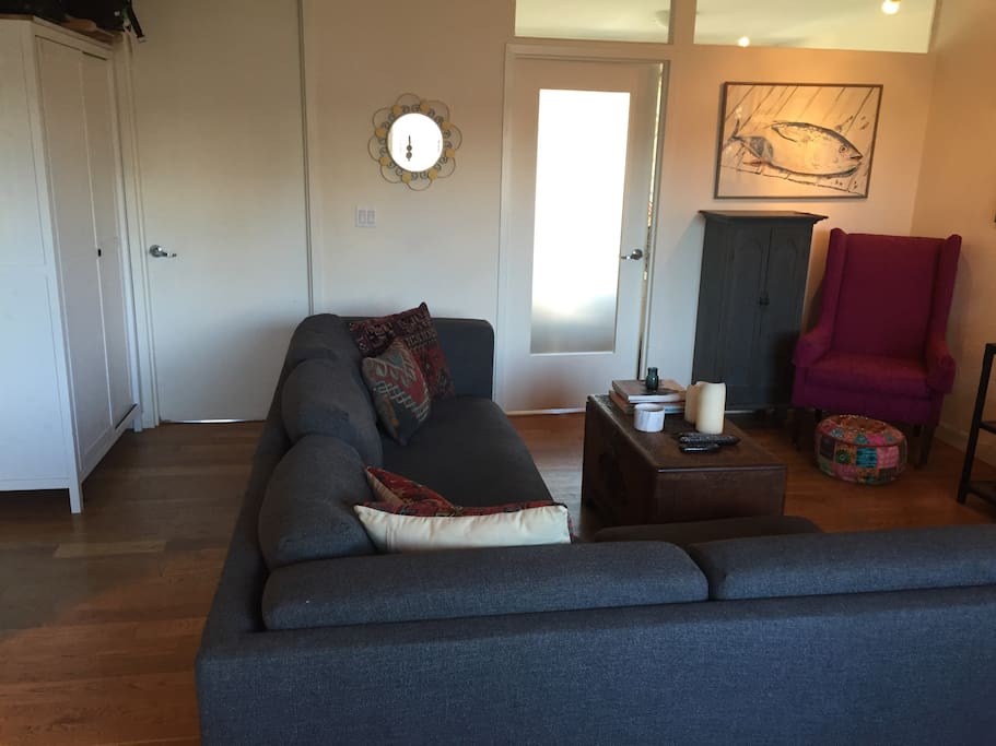 Living room with doors to the two bedrooms.