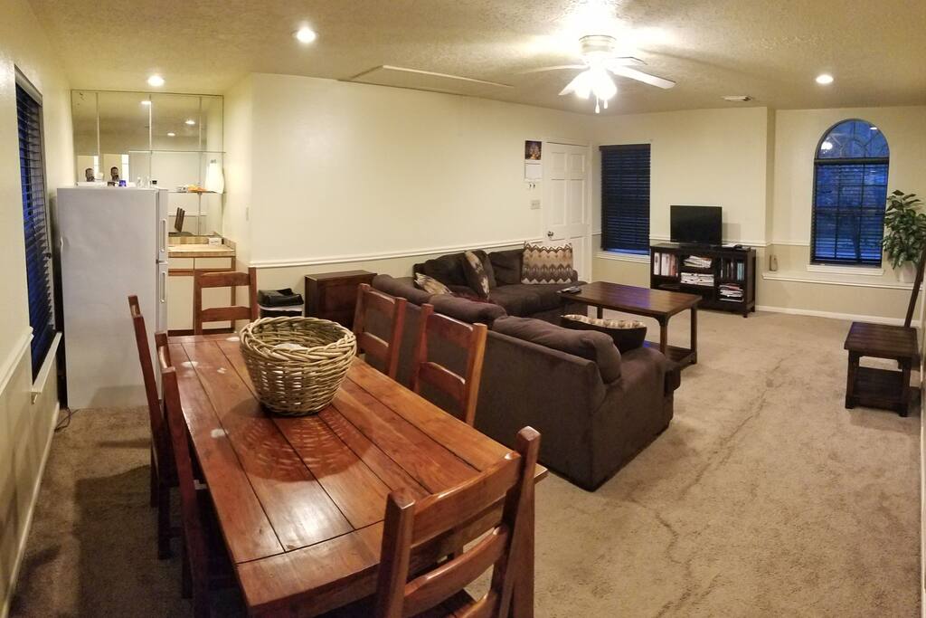 Heavy wood dining table to relax, watch tv, or work on the laptop.