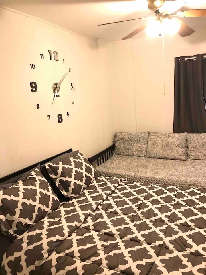 Bedroom Area: Queen size bed with Twin day bed, blackout curtains