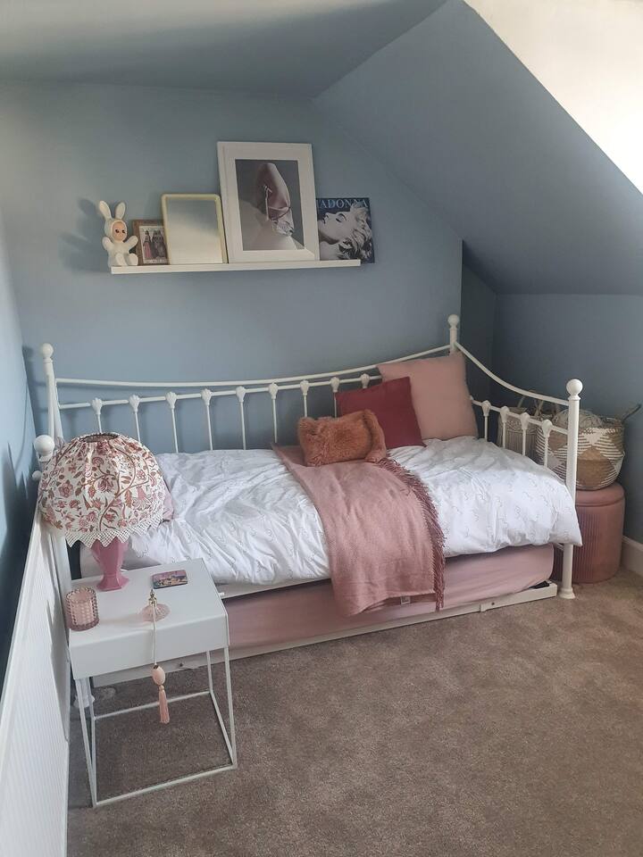 The room is single, with a pull out trundle bed that's another full sized single at the same height as the "proper" bed. The room's big enough for both.